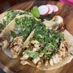 Chicken tacos with cilantro.