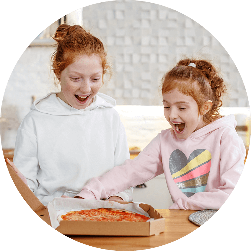 Kids enjoying a Cheese Pizza.